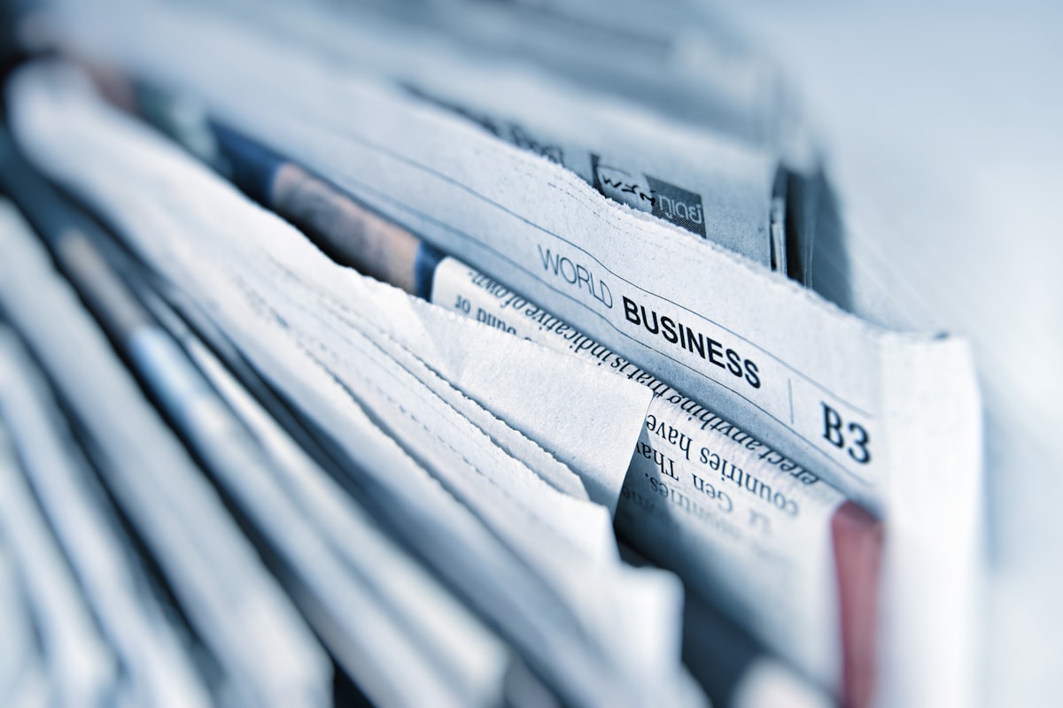 Journalists and communications professionals working in a modern newsroom