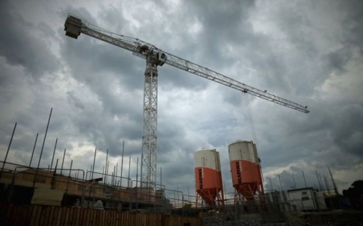 A crane is seen against a cloudy backdrop as Kier fell to a &pound;245m loss