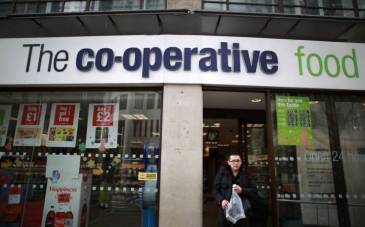 Shoppers stand outside a Co-op supermarket, which saw sales rise 1.7 per cent on a like for like basis in the first half of 2019