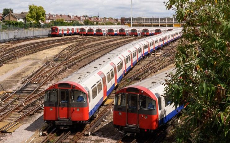 Two Tiube trains travel on above-ground tracks