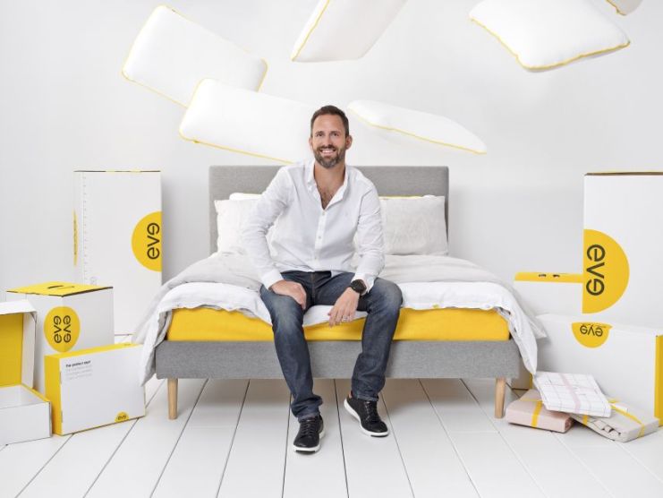 Eve Sleep CEO James Sturrock sits on one of his company's mattresses