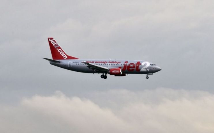 Package holiday provider Jet2 said that it would make a loss of up to &pound;385m for the full year after it cancelled all trips until 23 June due to Covid-19.