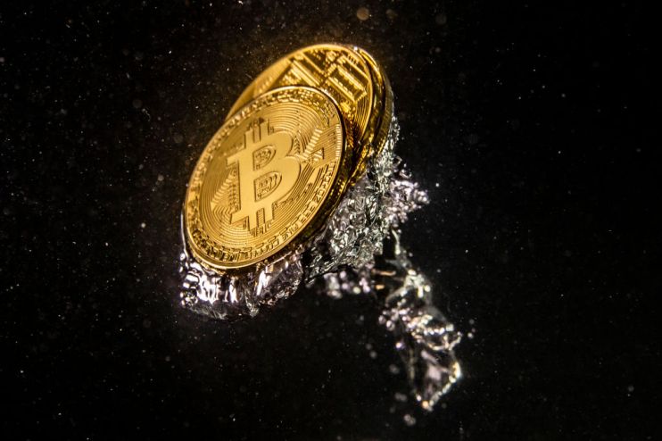 LONDON, ENGLAND - AUGUST 15: (EDITORS NOTE: Image has been rotated 180 degrees.) In this photo illustration a visual representation of the digital currency Bitcoin sinks into water on August 15, 2018 in London, England. Most digital currencies including Bitcoin, (BTC) Ethereum, (ETH) Ripple (XRP) and Stella (XLM) have seen a dramatic fall in their prices throughout 2018 amid a 'mass sell-off'. In December 2017 the price of BTC hit $20,000 USD but has since fallen to around $6000 USD. (Photo Illustration by Dan Kitwood/Getty Images)