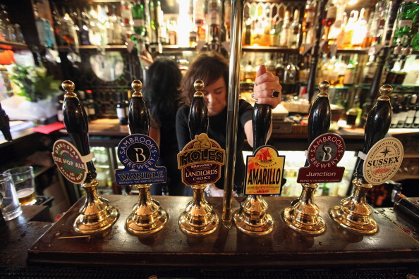 LONDON, ENGLAND - FEBRUARY 16: A barmaid pulls a pint in The Harp pub on the day it was named as the Campaign for Real Ale's national pub of the year on February 16, 2011 in London, England. It is the first time that a London pub has been awarded the the prestigious title of CAMRA pub of the year. The Harp, which is owned by real ale pioneer Bridget Walsh, is situated yards from Trafalgar Square and Covent Garden. CAMRA commented that the pub "retains its appeal as a true local, even though situated in the tourist heart of the capital". (Photo by Oli Scarff/Getty Images)