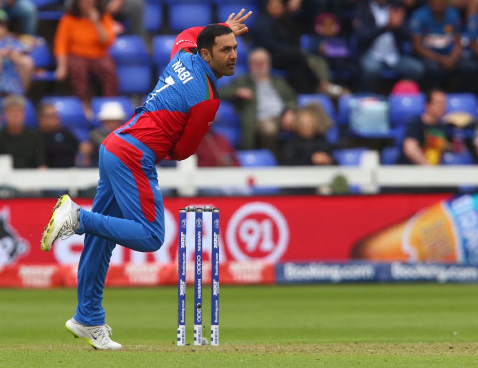 Afghanistan's Mohammad Nabi bowls during the 2019 Cricket World Cup group stage match between Afghanistan and Sri Lanka at Sophia Gardens stadium in Cardiff, south Wales, on June 4, 2019. (Photo by GEOFF CADDICK / AFP) / RESTRICTED TO EDITORIAL USE (Photo credit should read GEOFF CADDICK/AFP/Getty Images)