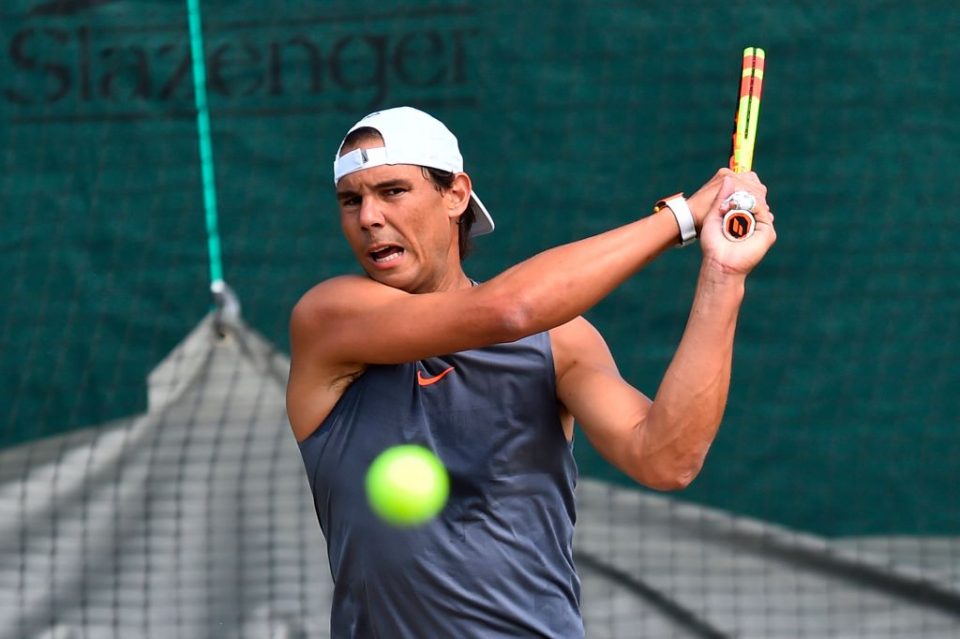 Rafael Nadal hits a return during a practice session at The All England Tennis Club in Wimbledon, southwest London, on June 30, 2019, on the eve of the start of the 2019 Wimbledon Championships tennis tournament. (Photo by Glyn KIRK / AFP) / RESTRICTED TO EDITORIAL USE        (Photo credit should read GLYN KIRK/AFP/Getty Images)