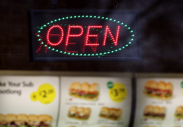 BRISTOL, ENGLAND - JANUARY 07: An open sign outside a branch of a takeaway chain on January 7, 2013 in Bristol, England. A government-backed TV advert - made by Aardman, the creators of Wallace and Gromit - to promote healthy eating in England, is to be shown for the first time later today. England has one of the highest rates of obesity in Europe - costing the NHS 5 billion GDP each year - with currently over 60 percent of adults and a third of 10 and 11 year olds thought to be overweight or obese. (Photo by Matt Cardy/Getty Images)