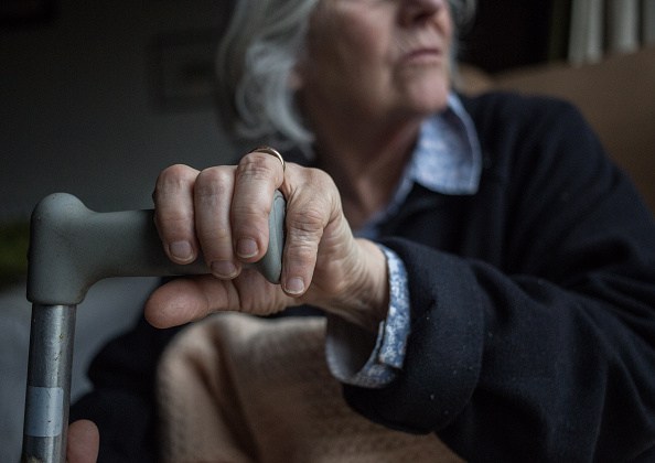 BRISTOL, ENGLAND - FEBRUARY 16: In this photo illustration an elderly person sits in a chair at home on February 16, 2015 near Bristol, England. The issues affecting the elderly, along with education and the economy are likely to be key elections issues in the forthcoming general election in May. (Photo by Matt Cardy/Getty Images)