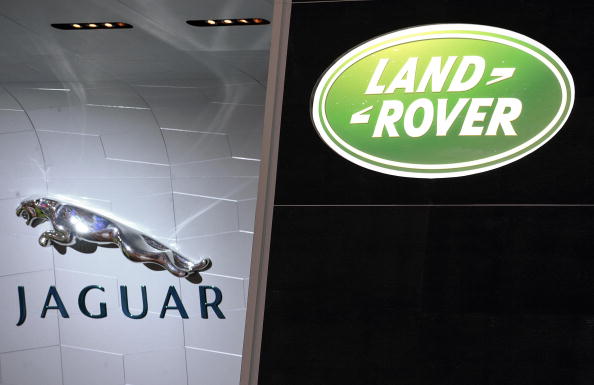 View of the logos of the British brands Janguar and Land Rover pictured at the Geneva International Motor Show, on March 4, 2008 in Geneva. Indian carmaker Tata Motors is expected to announce its purchase of luxury British brands Jaguar and Land Rover from struggling US automaker Ford later this week, signalling its ambitions for greater things, industry press reported last month. AFP PHOTO FABRICE COFFRINI (Photo credit should read FABRICE COFFRINI/AFP/Getty Images)