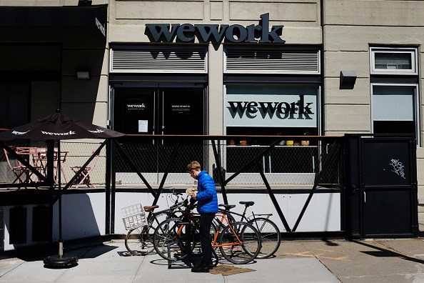 NEW YORK, NEW YORK - MARCH 26: People walk by the co-working space WeWork in the Williamsburg neighborhood in Brooklyn on March 26, 2019 in New York City. WeWork, which lets freelancers and other non-traditional workers to become members in a shared or flexible office space, has expanded globally over the last year but continues to suffer large losses. While in 2018 WeWork saw a more than doubling of its sales to $1.82 billion from a year earlier, the company&rsquo;s losses over that same period also more than doubled to $1.93 billion. (Photo by Spencer Platt/Getty Images)