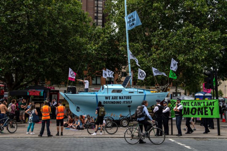 Extinction Rebellion's boats are daubed in slogans and symbols of the protest movement