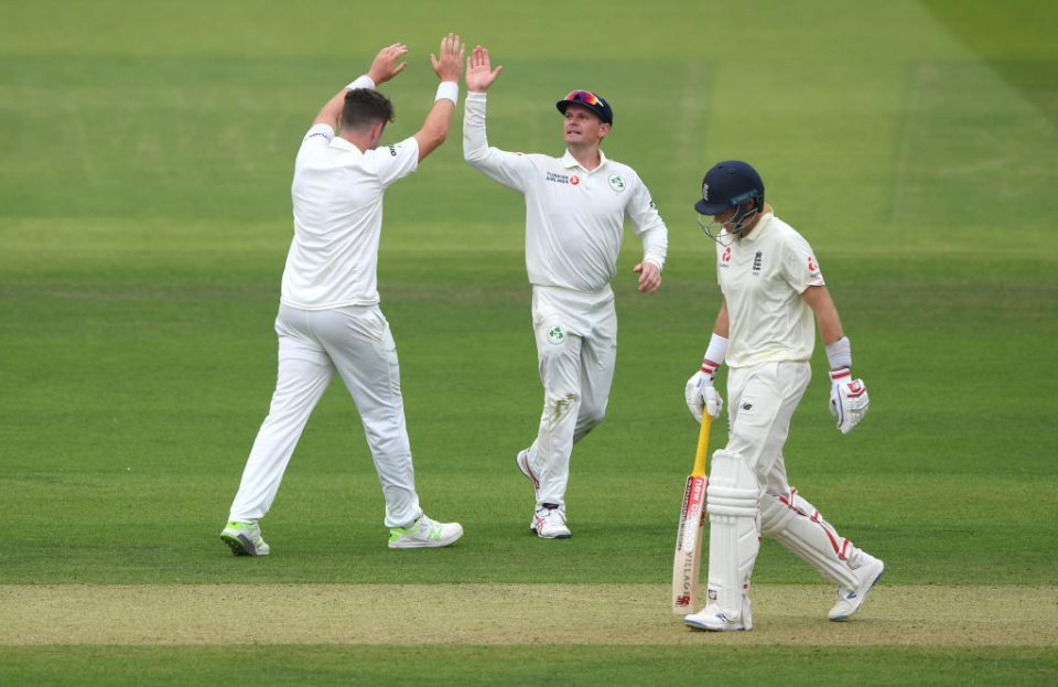 LONDON, ENGLAND - JULY 25:Ireland bowler Mark Adair celebrates with captain William Porterfield after dismissing England batsman Joe Root during day two of the Specsavers Test Match between England and Ireland at Lord's Cricket Ground on July 25, 2019 in London, England. (Photo by Stu Forster/Getty Images)