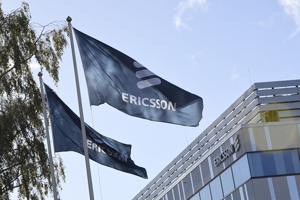 Flags with the logo of telecoms equipment maker Ericsson flutter outside the company's headquarters in Stockholm on October 4, 2016. Ericsson confirmed recent media reports that it will cut 3,000 jobs in Sweden, including in production, research and development. / AFP / TT News Agency / Maja SUSLIN / Sweden OUT (Photo credit should read MAJA SUSLIN/AFP/Getty Images)