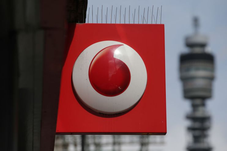 A Vodafone logo is seen at a store in central London on May 16, 2017. Vodafone logged today a large annual net loss after slashing the value of its troubled Indian division, but underlying earnings soared on a solid European performance. / AFP PHOTO / Daniel Leal-Olivas (Photo credit should read DANIEL LEAL-OLIVAS/AFP/Getty Images)