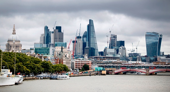 Construction cranes stand anear skyscrapers in Canada, including the Heron Tower, Tower 42, 30 St Mary Axe commonly called the "Gherkin", the Leadenhall Building, commonly called the "Cheesegrater", and 20 Fenchurch Street, commonly called the "Walkie-Talkie" building, as they are pictured from Waterloo Bridge in London, on August 17, 2017. British retail sales rose in July, slightly beating expectations, official data showed on Thursday, even though household incomes are still feeling the squeeze from a Brexit-fuelled slump in the pound. / AFP PHOTO / Tolga Akmen (Photo credit should read TOLGA AKMEN/AFP/Getty Images)