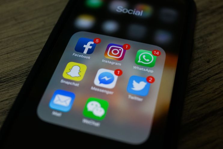 This photo illustration taken on March 22, 2018 shows apps for Facebook, Instagram, Twitter and other social networks on a smartphone in New Delhi. (Photo by CHANDAN KHANNA / AFP) (Photo credit should read CHANDAN KHANNA/AFP/Getty Images)