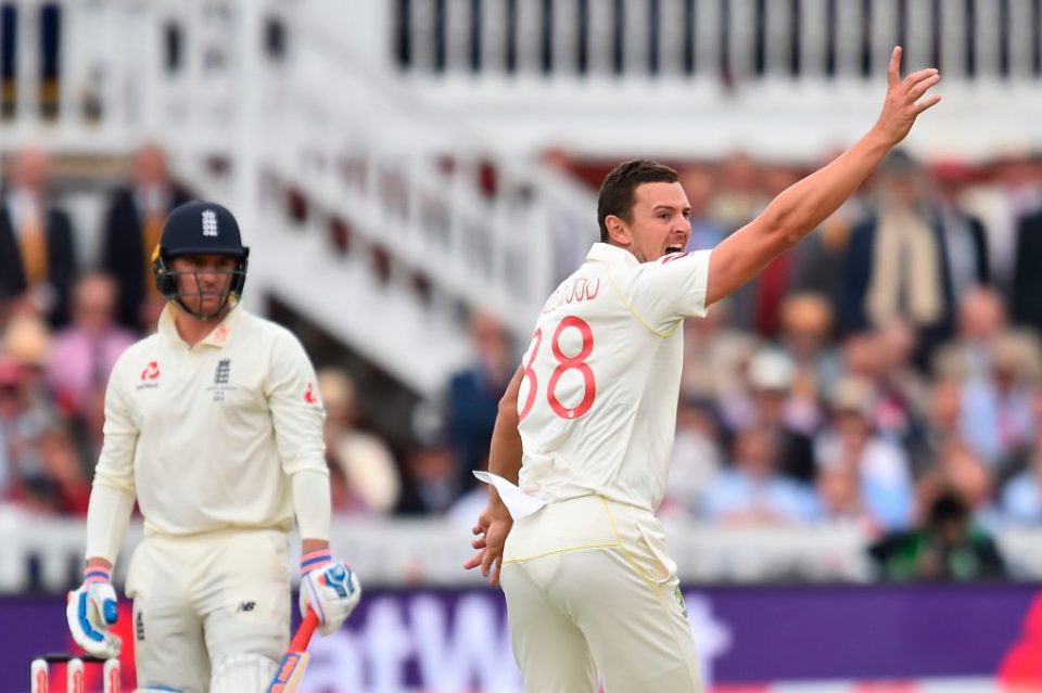 Australia's Josh Hazlewood (R) celebrates taking the wicket of England's Jason Roy (L) for 0 runs on the second day of the second Ashes cricket Test match between England and Australia at Lord's Cricket Ground in London on August 15, 2019. (Photo by Glyn KIRK / AFP) / RESTRICTED TO EDITORIAL USE. NO ASSOCIATION WITH DIRECT COMPETITOR OF SPONSOR, PARTNER, OR SUPPLIER OF THE ECB        (Photo credit should read GLYN KIRK/AFP/Getty Images)