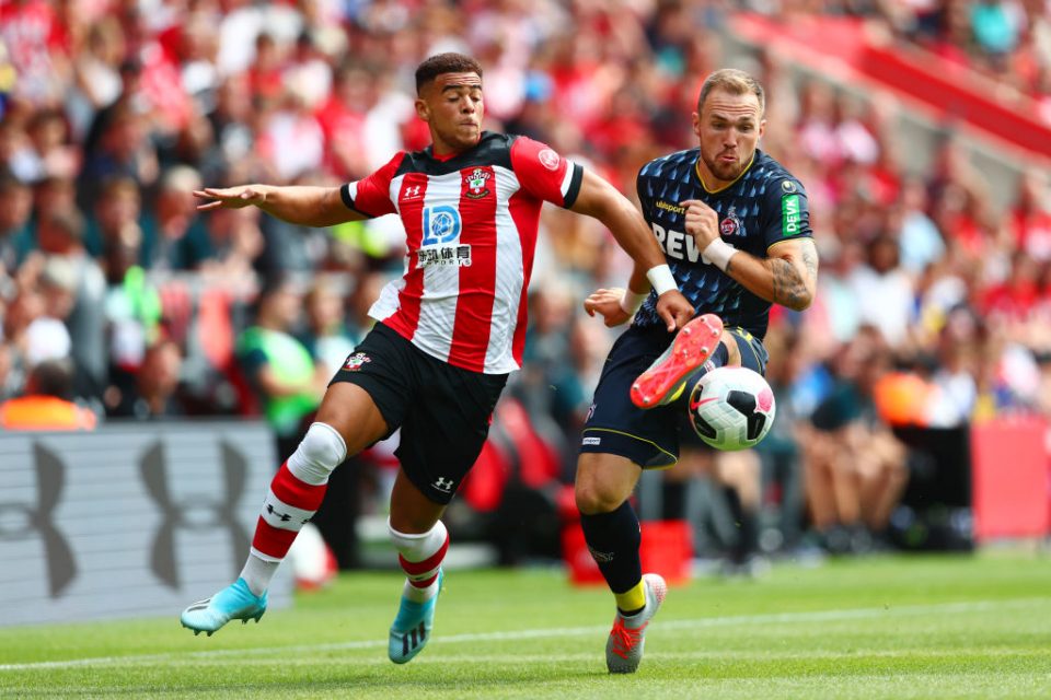 SOUTHAMPTON, ENGLAND - AUGUST 03: Che Adams of Southampton battles for the ball with Rafael Czichos of 1.FC Koln during the Pre-Season Friendly match between Southampton and FC Koln at St. Mary's Stadium on August 03, 2019 in Southampton, England. (Photo by Dan Istitene/Getty Images)