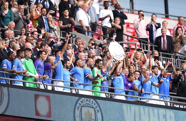 LONDON, ENGLAND - AUGUST 04: David Silva and Sergio Aguero of Manchester City lift the FA Community Shield following their team's victory in the FA Community Shield match between Liverpool and Manchester City at Wembley Stadium on August 04, 2019 in London, England. (Photo by Laurence Griffiths/Getty Images)