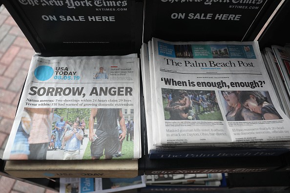 PALM BEACH, FLORIDA - AUGUST 05: A GateHouse Media owned Palm Beach Post and the Gannett Co. owned USA Today are seen for sale at a newsstand on August 05, 2019 in Palm Beach, Florida. GateHose Media announced an agreement to acquire Gannett Co. Inc, which would create the largest local news publishing organization in the U.S. (Photo by Joe Raedle/Getty Images)