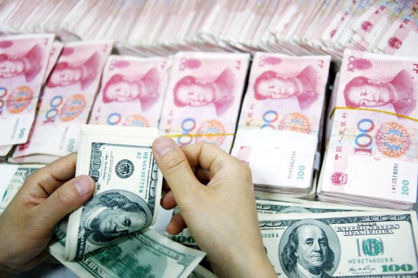 Chinese currency falls to financial crisis levels on trade war woes