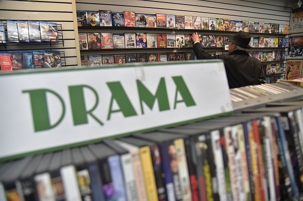 A client checks movies in a DVD store called "Video Room", located on 3rd Avenue in New York City, on April 19, 2018. (Photo by HECTOR RETAMAL / AFP) (Photo credit should read HECTOR RETAMAL/AFP/Getty Images)