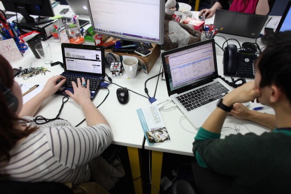 LONDON, ENGLAND - MARCH 15: People work at computers in TechHub, an office space for technology start-up entrepreneurs, near the Old Street roundabout in Shoreditch which has been dubbed 'Silicon Roundabout' due to the number of technology companies operating from the area on March 15, 2011 in London, England. Entrepreneurs using TechHub are predominantly product-oriented tech companies who rent desk space and use the fast wifi. The relatively low rental rates and proximity to media and internet companies has made the area close to the roundabout a prime location for IT firms and web entrepreneurs. (Photo by Oli Scarff/Getty Images)