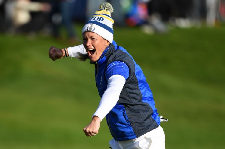 Europe's Suzann Pettersen celebrates after winning her tie on the 18th green in the singles on the third day of The Solheim Cup golf tournament at Gleneagles in Scotland, on September 15, 2019. - Europe regained the Solheim Cup with a thrilling 14.5-13.5 victory over the United States on Sunday at Gleneagles. (Photo by ANDY BUCHANAN / AFP) / RESTRICTED TO EDITORIAL USE (Photo credit should read ANDY BUCHANAN/AFP/Getty Images)
