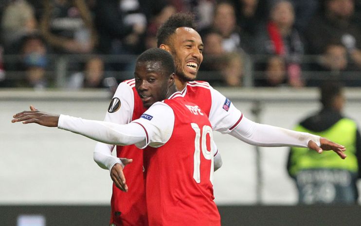Arsenal's Gabonese striker Pierre-Emerick Aubameyang (L) celebrates scoring the 0-3 with his team-mate French-born Ivorian midfielder Nicolas Pepe during the UEFA Europa League Group F football match Eintracht Frankfurt v Arsenal in Frankfurt am Main, western Germany, on September 19, 2019. (Photo by Daniel ROLAND / AFP) (Photo credit should read DANIEL ROLAND/AFP/Getty Images)