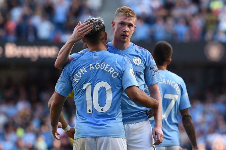Manchester City's Belgian midfielder Kevin De Bruyne (R) celebrates with Manchester City's Argentinian striker Sergio Aguero after scoring his team's eighth goal during the English Premier League football match between Manchester City and Watford at the Etihad Stadium in Manchester, north west England, on September 21, 2019. (Photo by Oli SCARFF / AFP) / RESTRICTED TO EDITORIAL USE. No use with unauthorized audio, video, data, fixture lists, club/league logos or 'live' services. Online in-match use limited to 120 images. An additional 40 images may be used in extra time. No video emulation. Social media in-match use limited to 120 images. An additional 40 images may be used in extra time. No use in betting publications, games or single club/league/player publications. / (Photo credit should read OLI SCARFF/AFP/Getty Images)