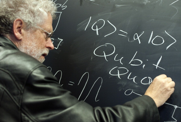 Austrian physicist Anton Zeilinger writes a Qubit on a blackboard during a preview of the dOCUMENTA (13) fair for contemporary art on June 7, 2012 in Kassel, central Germany. The exhibition of modern and contemporary art is running from June 9 to September 16, 2012. Documenta, one of the world's biggest contemporary art fairs is accompanied by events in Afghanistan, Egypt and Canada and takes place every five years in Kassel. AFP PHOTO / BARBARA SAX (Photo credit should read BARBARA SAX/AFP/GettyImages)