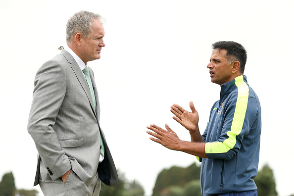TAURANGA, NEW ZEALAND - JANUARY 16: Commentator Tom Moody speaks to coach Rahul Dravid of India during the ICC U19 Cricket World Cup match between India and Papua New Guinea at Bay Oval on January 16, 2018 in Tauranga, New Zealand. (Photo by Hagen Hopkins/Getty Images)