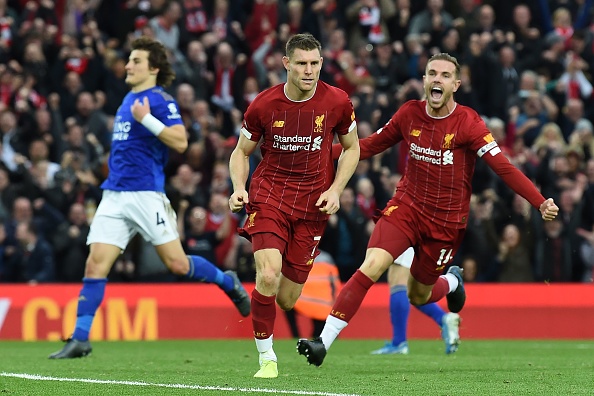 Liverpool's English midfielder James Milner (C) celebrates after he kicks a penalty and scores his team's second goal during the English Premier League football match between Liverpool and Leicester City at Anfield in Liverpool, north west England on October 5, 2019. (Photo by Paul ELLIS / AFP) / RESTRICTED TO EDITORIAL USE. No use with unauthorized audio, video, data, fixture lists, club/league logos or 'live' services. Online in-match use limited to 120 images. An additional 40 images may be used in extra time. No video emulation. Social media in-match use limited to 120 images. An additional 40 images may be used in extra time. No use in betting publications, games or single club/league/player publications. / (Photo by PAUL ELLIS/AFP via Getty Images)