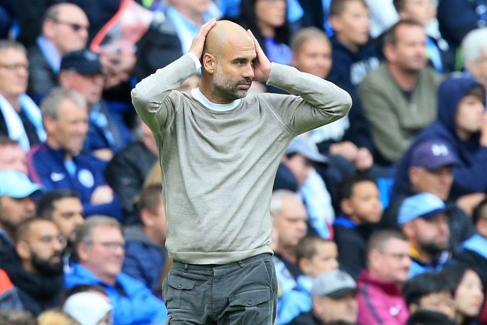 Manchester City's Spanish manager Pep Guardiola reacts during the English Premier League football match between Manchester City and Wolverhampton Wanderers at the Etihad Stadium in Manchester, north west England, on October 6, 2019. (Photo by Lindsey Parnaby / AFP) / RESTRICTED TO EDITORIAL USE. No use with unauthorized audio, video, data, fixture lists, club/league logos or 'live' services. Online in-match use limited to 120 images. An additional 40 images may be used in extra time. No video emulation. Social media in-match use limited to 120 images. An additional 40 images may be used in extra time. No use in betting publications, games or single club/league/player publications. / (Photo by LINDSEY PARNABY/AFP via Getty Images)