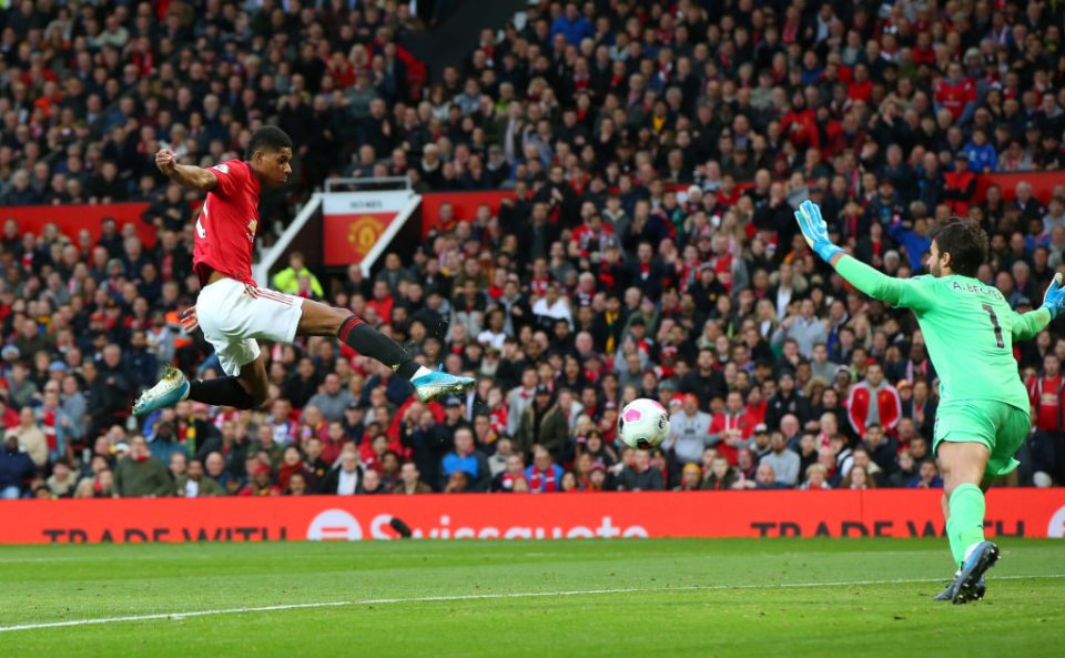 MANCHESTER, ENGLAND - OCTOBER 20: Marcus Rashford of Manchester United scores his sides first goal during the Premier League match between Manchester United and Liverpool FC at Old Trafford on October 20, 2019 in Manchester, United Kingdom. (Photo by Alex Livesey/Getty Images)