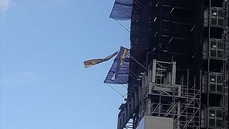 Extinction Rebellion protester flies flag from Big Ben