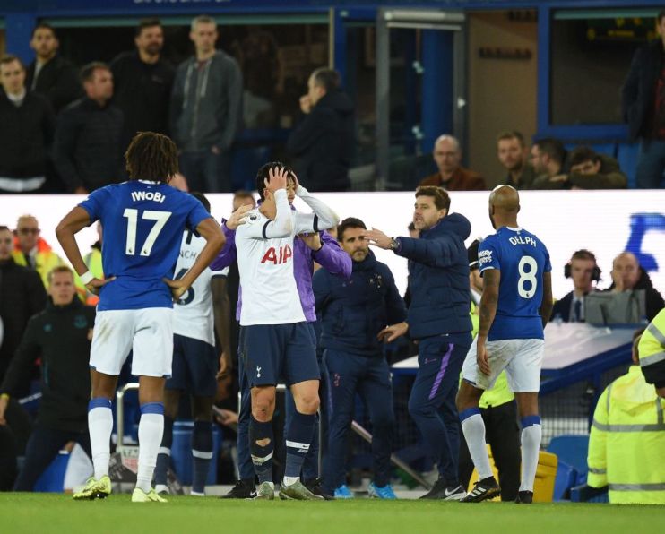 Tottenham Hotspur's South Korean striker Son Heung-Min (C) reacts after his involvement in an incident that resulted in an injury to Everton's Portuguese midfielder Andr&eacute; Gomes during the English Premier League football match between Everton and Tottenham Hotspur at Goodison Park in Liverpool, north west England on November 3, 2019. (Photo by Oli SCARFF / AFP) / RESTRICTED TO EDITORIAL USE. No use with unauthorized audio, video, data, fixture lists, club/league logos or 'live' services. Online in-match use limited to 120 images. An additional 40 images may be used in extra time. No video emulation. Social media in-match use limited to 120 images. An additional 40 images may be used in extra time. No use in betting publications, games or single club/league/player publications. / (Photo by OLI SCARFF/AFP via Getty Images)