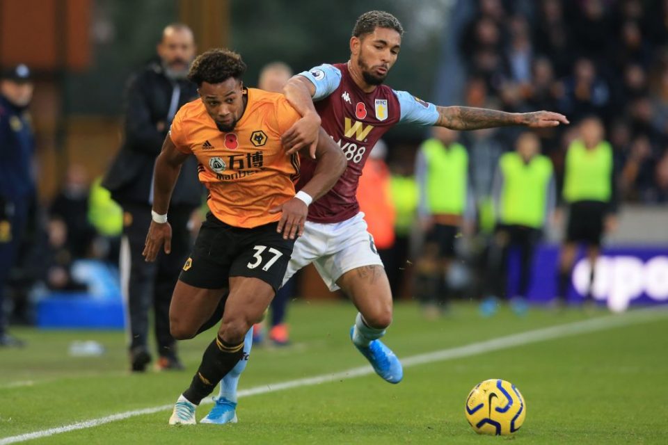 Wolverhampton Wanderers' Spanish striker Adama Traore (L) vies with Aston Villa's Brazilian midfielder Douglas Luiz (R) during the English Premier League football match between Wolverhampton Wanderers and Aston Villa at the Molineux stadium in Wolverhampton, central England on November 10, 2019. - Wolves won the game 2-1. (Photo by Lindsey Parnaby / AFP) / RESTRICTED TO EDITORIAL USE. No use with unauthorized audio, video, data, fixture lists, club/league logos or 'live' services. Online in-match use limited to 120 images. An additional 40 images may be used in extra time. No video emulation. Social media in-match use limited to 120 images. An additional 40 images may be used in extra time. No use in betting publications, games or single club/league/player publications. / (Photo by LINDSEY PARNABY/AFP via Getty Images)