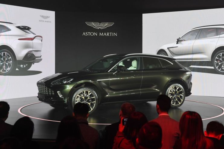 Aston Martin fell to a loss of over &pound;100m today as the luxury carmaker announced it would use 2020 to "reset" the business in order to compete in the supercar market.