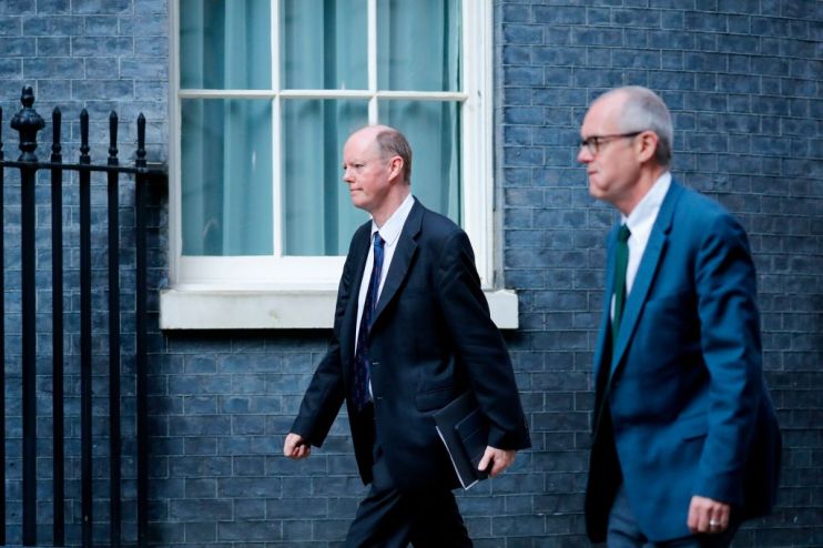 Chief medical officer Chris Whitty (L) and Britain's chief scientific adviser Patrick Vallance (R) arrive at 10 Downing Street. Their assessment of social distancing measures is unlikely to lead to a quick easing of the UK coronavirus lockdown