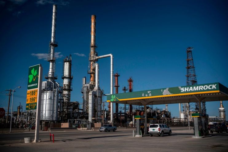 Global oil prices eased their rally this morning but remained on track for a huge weekly loss after unprecedented levels of volatility left producers and traders alike bruised.