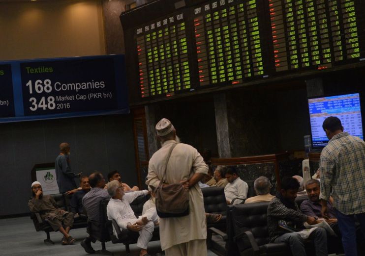 Pakistani stockbrokers at the Pakistan Stock Exchange (PSX) in Karachi