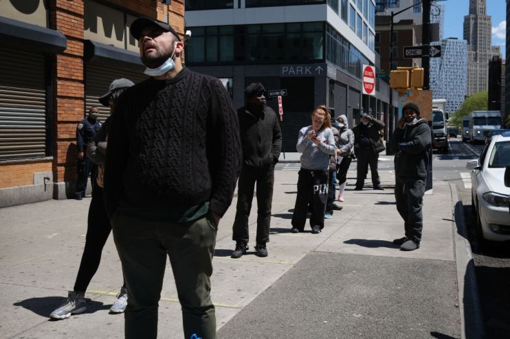 US jobless claims fall but remain at record levels