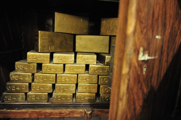 Gold hurtled to record peaks today before the sheer scale of its gains drew a burst of profit taking, which in turn helped the dollar up from two-year lows.