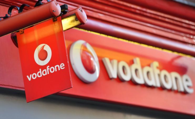 Vodafone has said its total revenue shrank by over two per cent in its third quarter due to contractions in Italy and Spain.