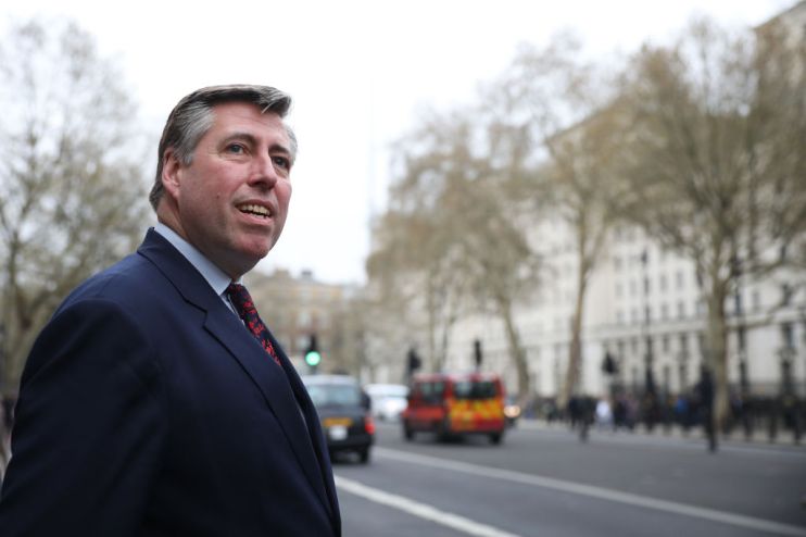 An influential senior Tory MP has urged the government to give workers a "clear and consistent message" that it is safe to return to the office.