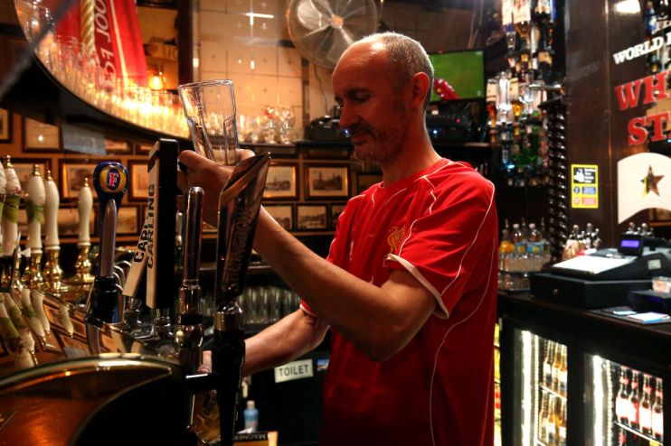 Fans Celebrate As Liverpool FC Lift The Premiership Trophy At Anfield