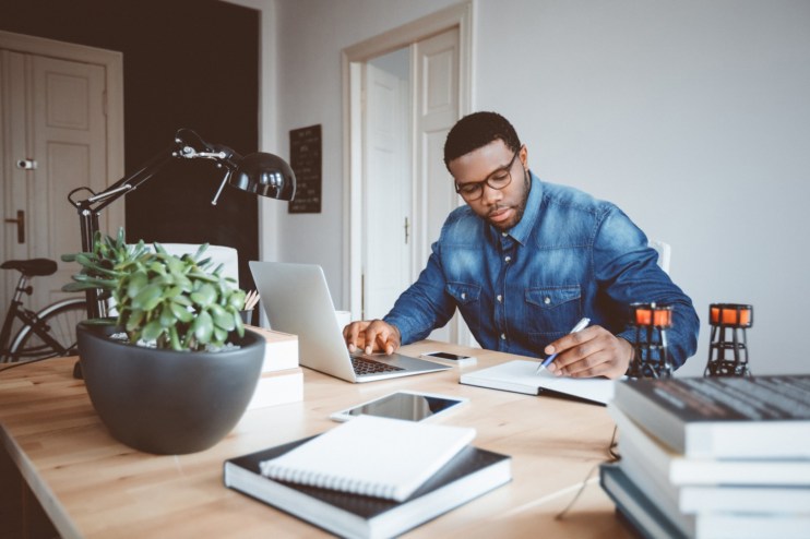 man working from home with laptop