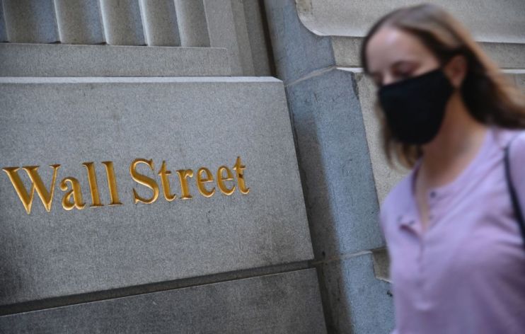 Wall Street closed lower this evening as deadlock over a new stimulus package raised concerns that time was running out to agree a deal