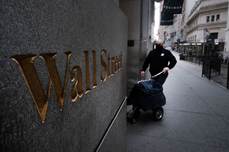 Wall Street closed higher tonight after a day of topsy-turvy trading as investors bet on the prospect of a new stimulus deal being agreed between Congress and the White House.